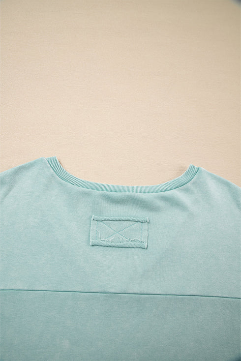 Mineral Wash Snap Trim V Neck Exposed Seam Drop Shoulder Curved Hem Long Sleeve Top